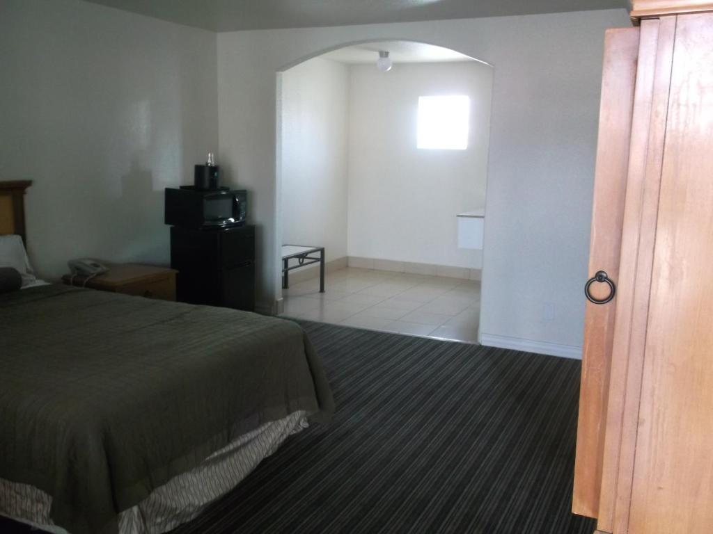 Travel Inn And Suites Fresno Quarto foto
